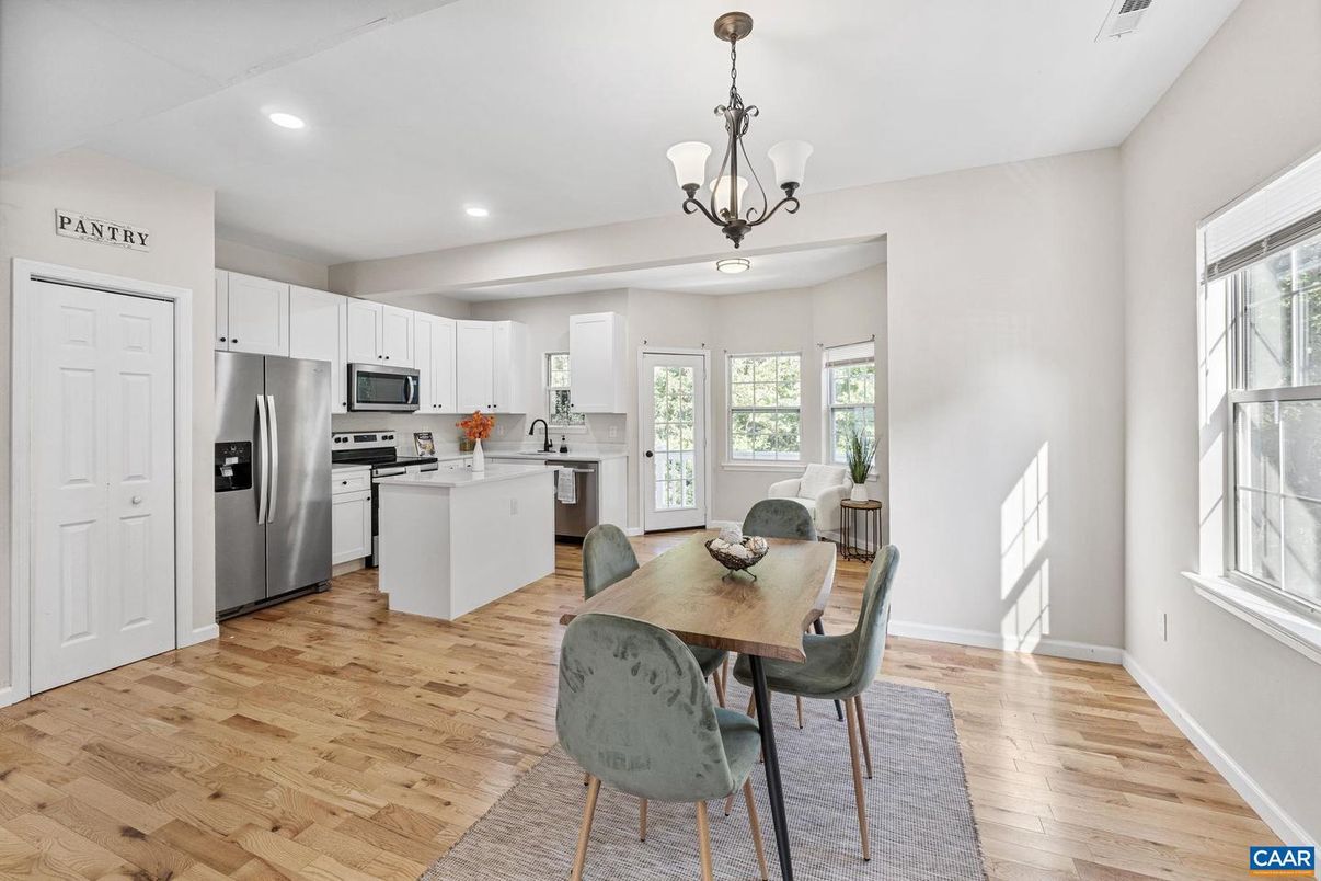 Chandelier, Dining room, Interior, Kitchen, Pendant Lights, Recessed Lighting, Stainless Steel Appliances, Wood Texture Flooring
