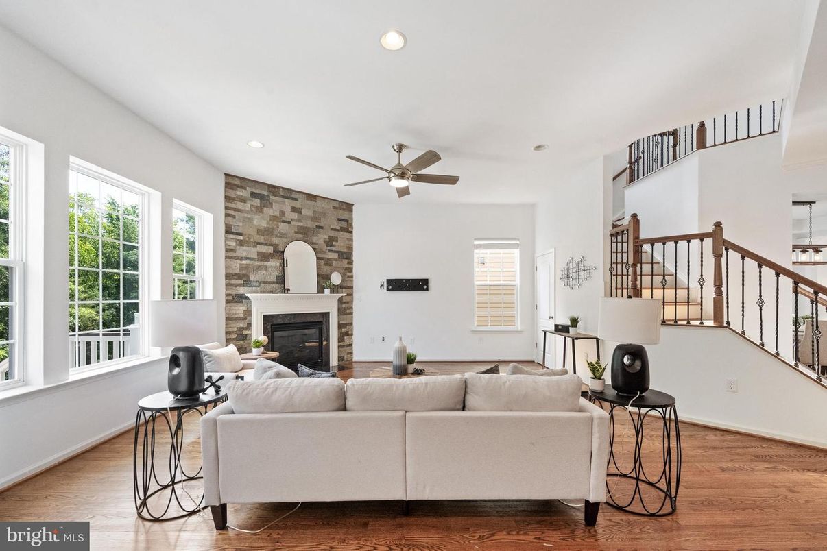 Fireplace, Interior, Living room, Recessed Lighting, Stone Walls, Wood Texture Flooring