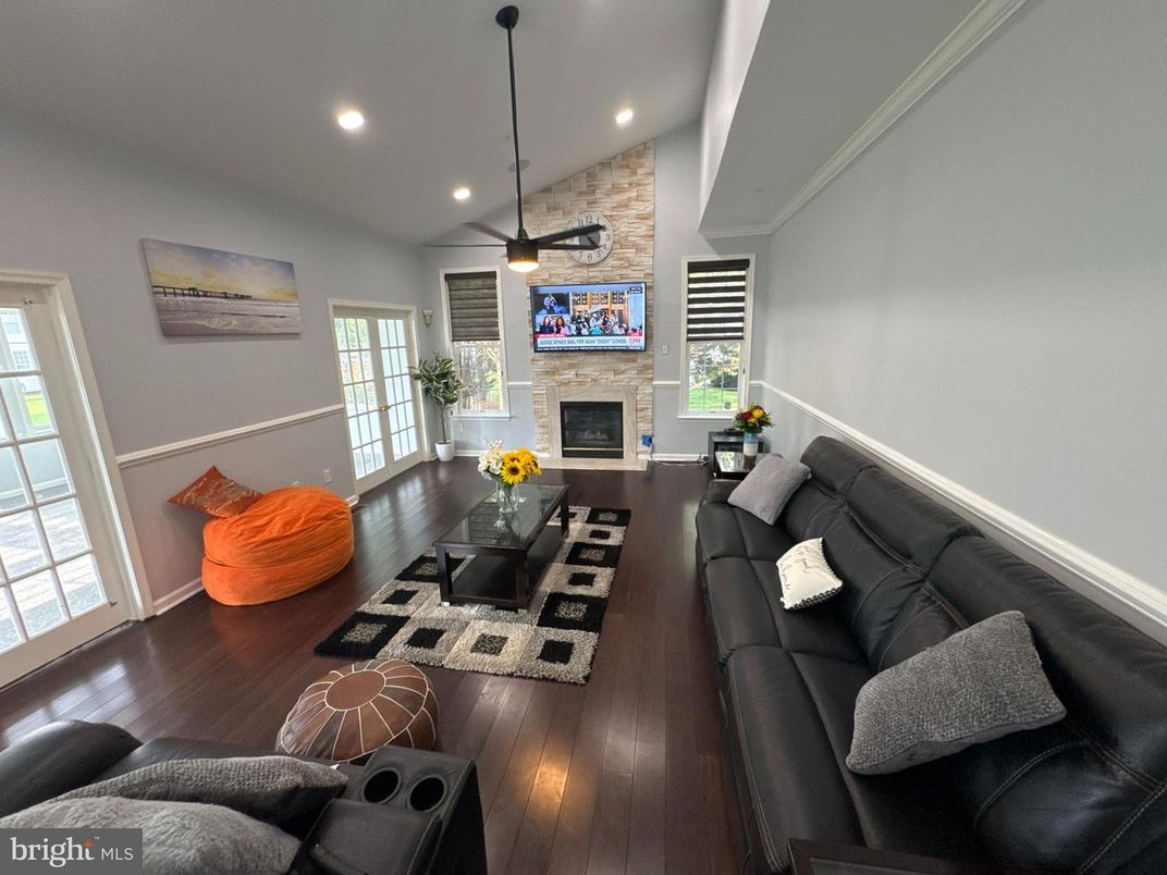 Fireplace, Interior, Living room, Recessed Lighting, Stone Walls, Wood Texture Flooring