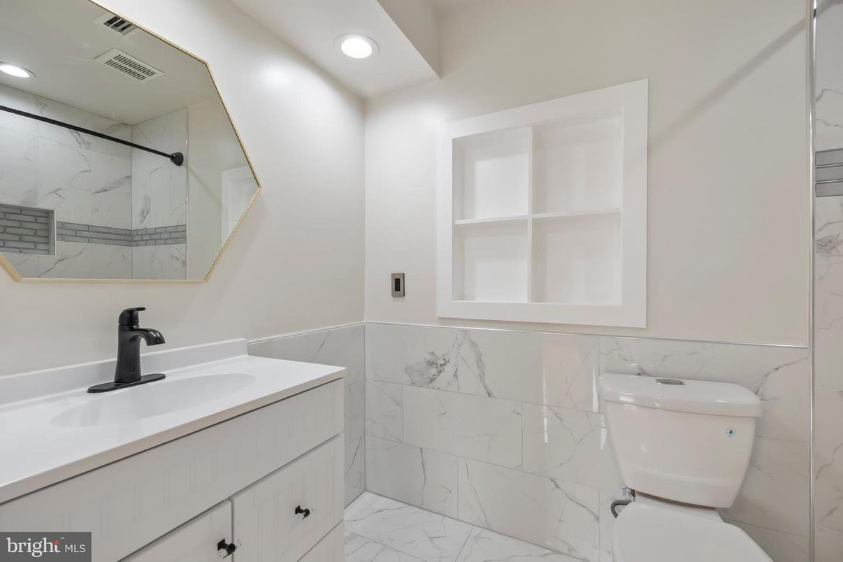 Bathroom, Dual Sink Vanities, Interior, Marble, Marble Walls, Recessed Lighting