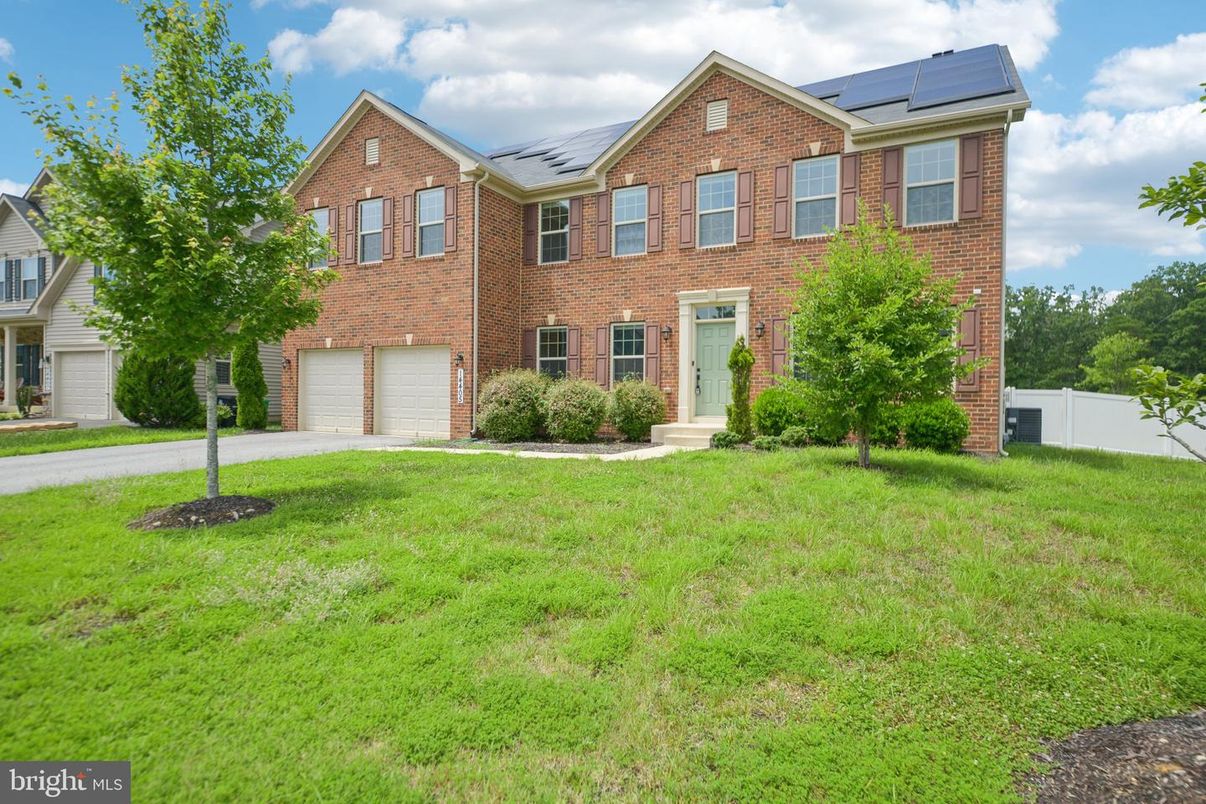 Attached, Backyard, Exterior, Facade, Brick Facade, Solar Panels, Brick Traditional