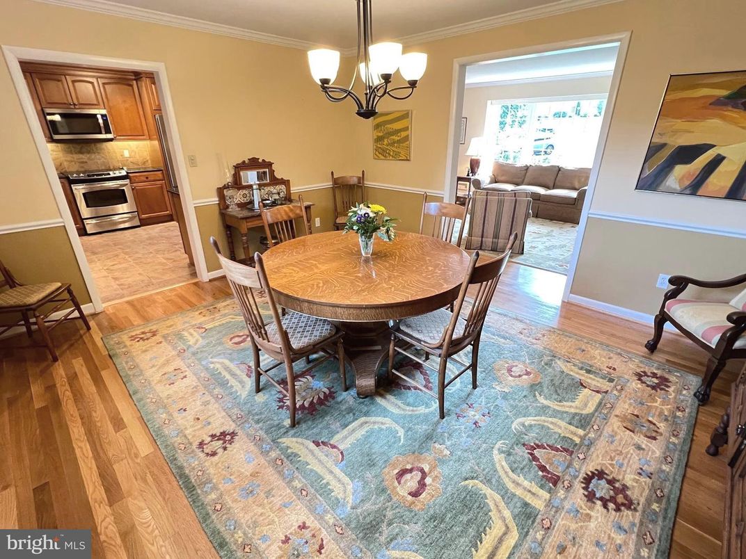 Chandelier, Dining room, Interior, Kitchen, Living room, Stainless Steel Appliances, Wood Texture Flooring