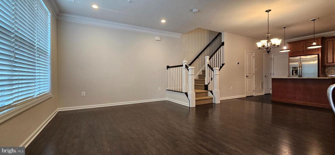 Chandelier, Empty room, Interior, Kitchen, Pendant Lights, Recessed Lighting, Stainless Steel Appliances, Wood Texture Flooring