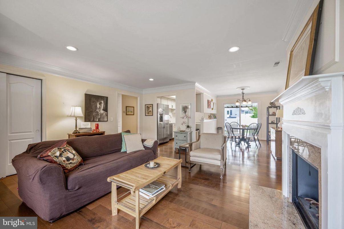 Dining room, Fireplace, Interior, Living room, Pendant Lights, Recessed Lighting, Wood Texture Flooring
