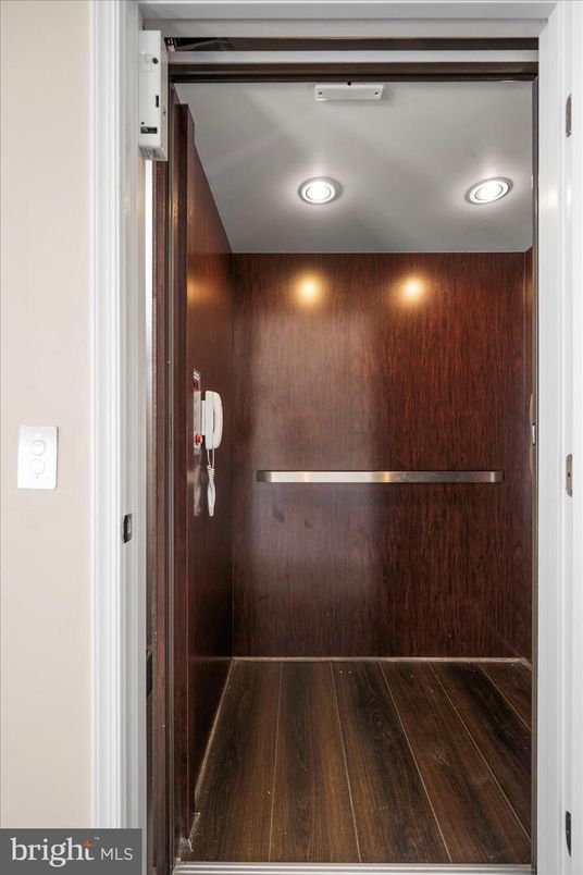 Elevator, Interior, Recessed Lighting, Wood Texture Flooring, Wooden Walls