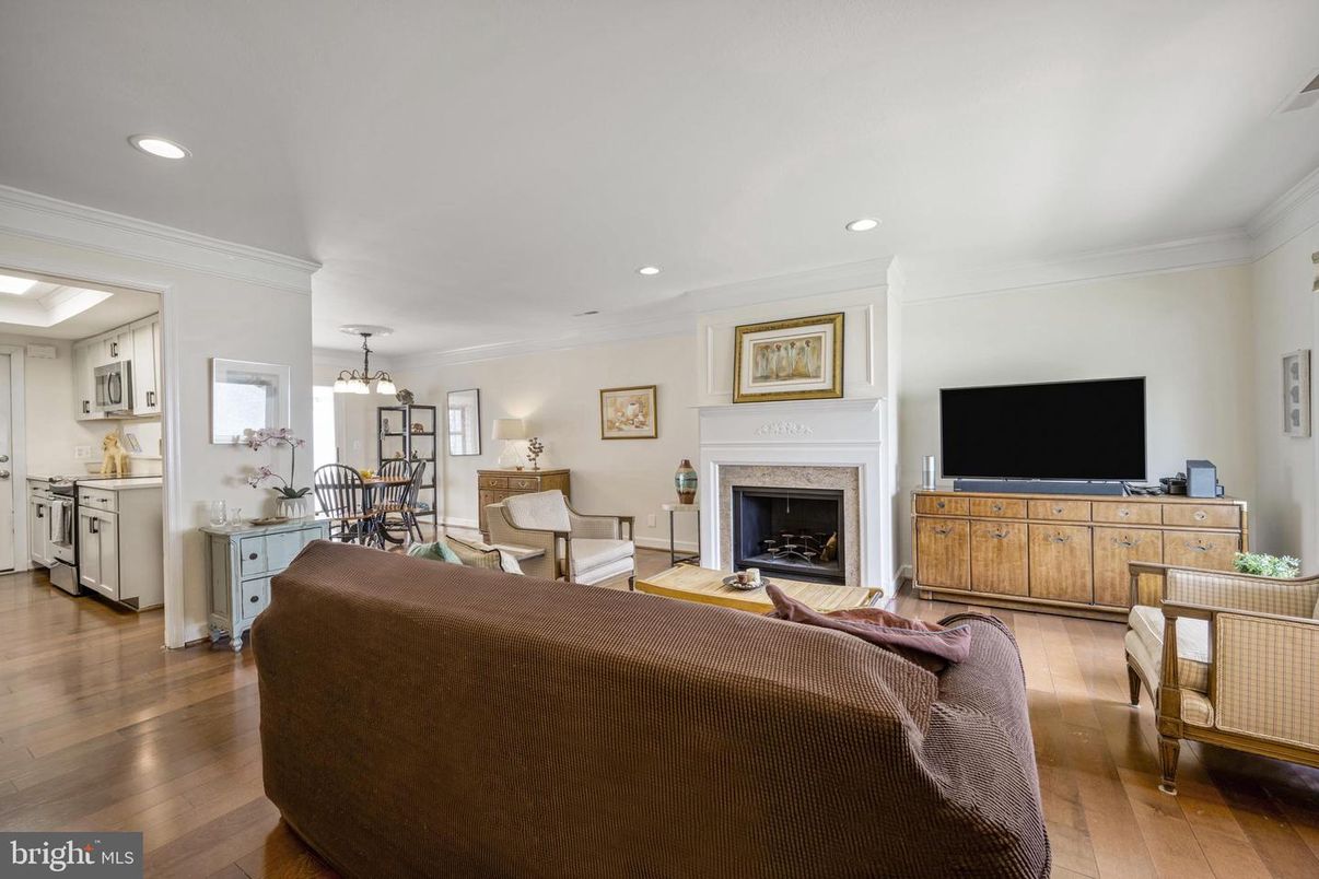 Chandelier, Dining room, Fireplace, Interior, Kitchen, Living room, Recessed Lighting, Wood Texture Flooring