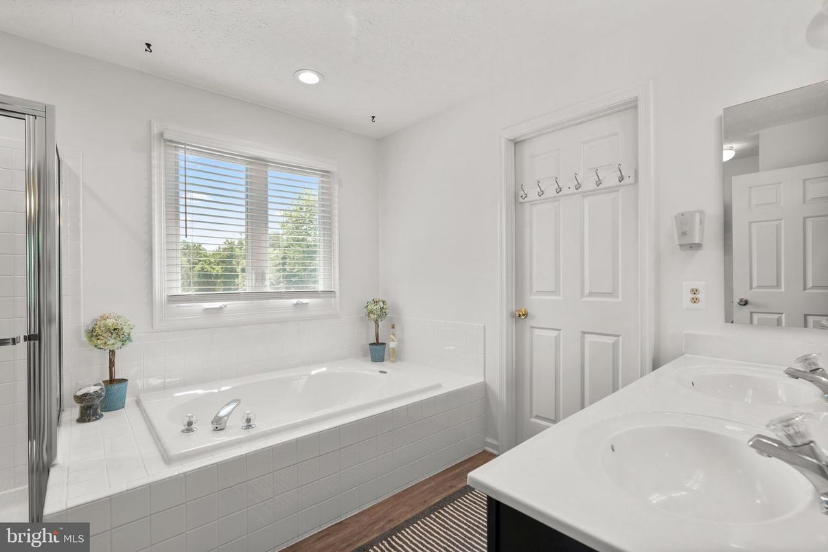 Bathroom, Dual Sink Vanities, Interior, Recessed Lighting, Wood Texture Flooring