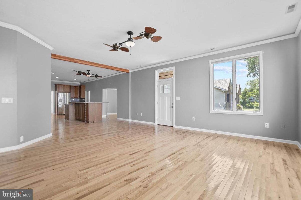 Empty room, Interior, Kitchen, Recessed Lighting, Stainless Steel Appliances, Wood Texture Flooring