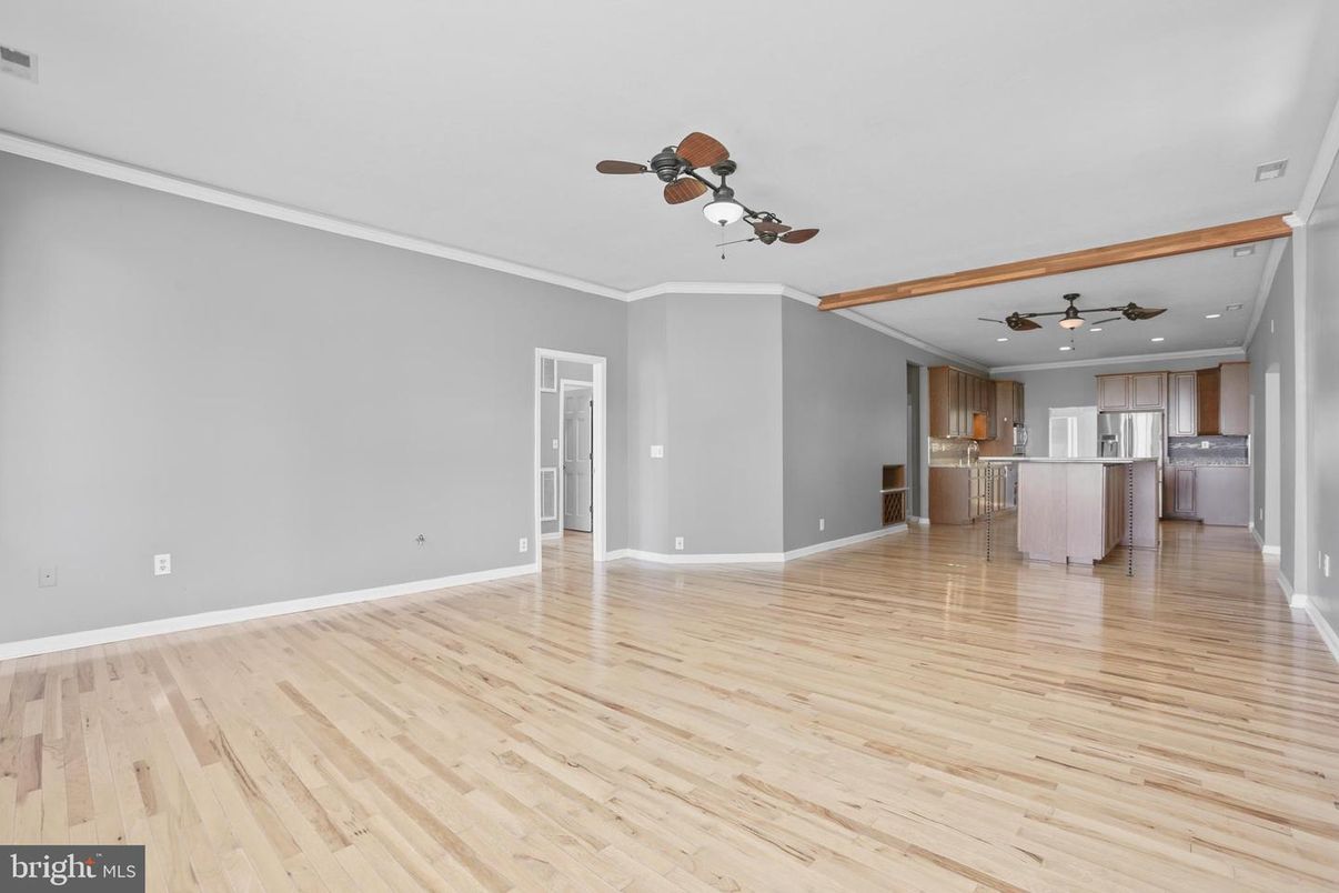 Empty room, Interior, Kitchen, Recessed Lighting, Stainless Steel Appliances, Wood Texture Flooring