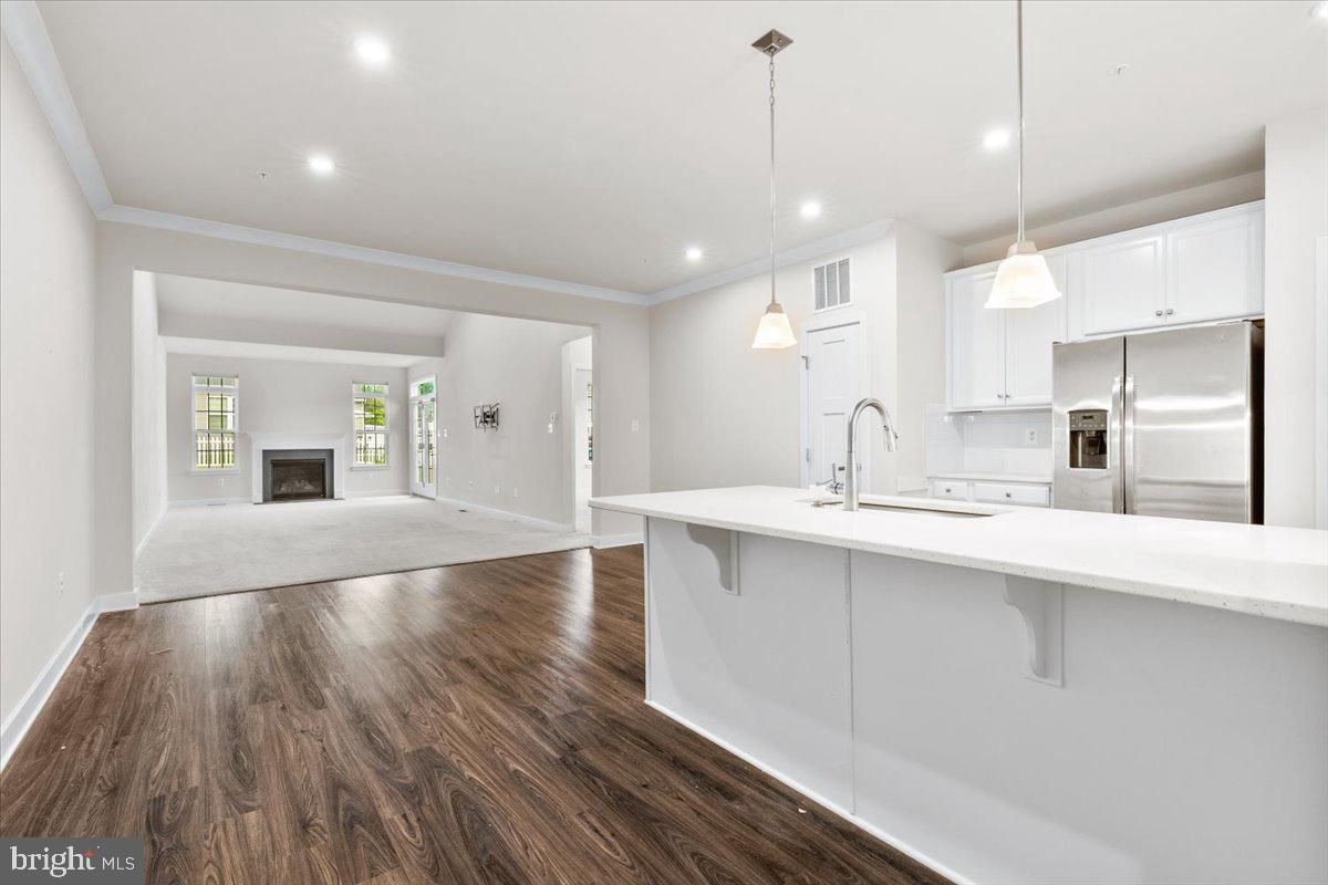 Fireplace, Interior, Kitchen, Pendant Lights, Recessed Lighting, Stainless Steel Appliances, Wood Texture Flooring