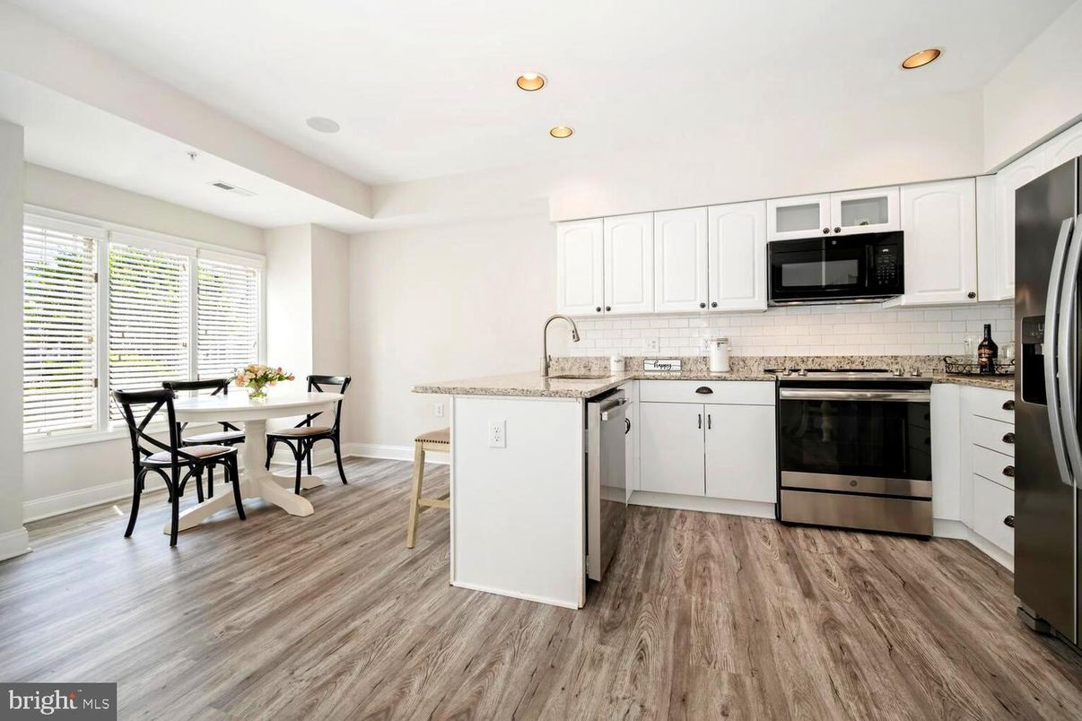 Dining room, Interior, Kitchen, Recessed Lighting, Stainless Steel Appliances, Wood Texture Flooring