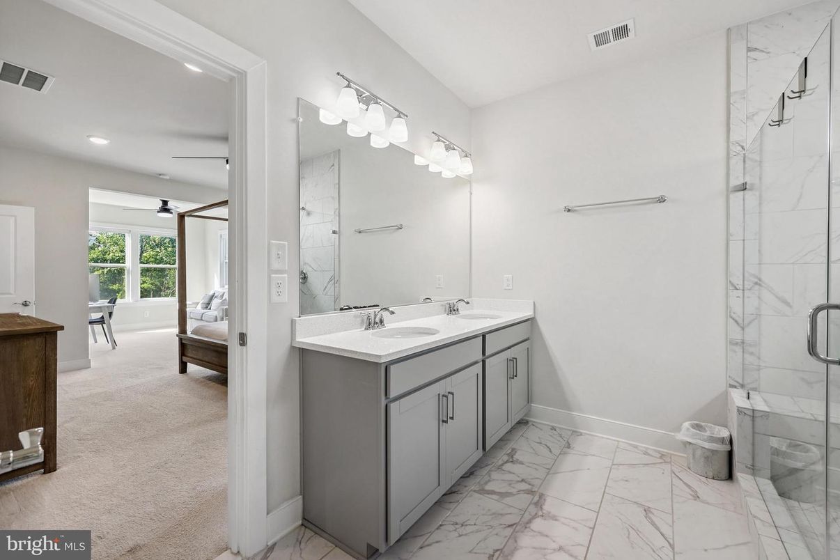 Bathroom, Dual Sink Vanities, Glass Shower, Interior, Marble, Marble Walls, Recessed Lighting