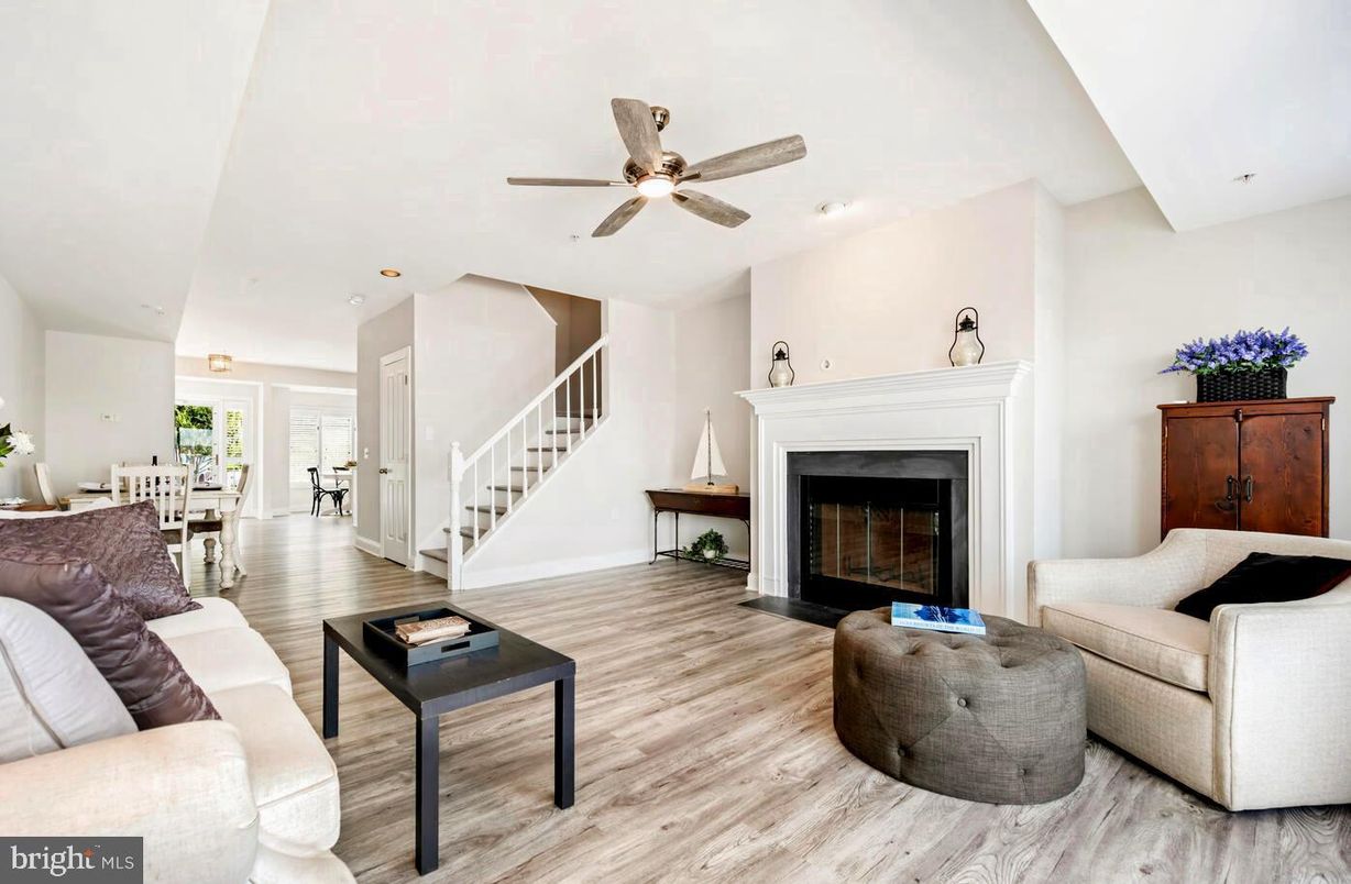 Dining room, Fireplace, Interior, Living room, Recessed Lighting, Wood Texture Flooring