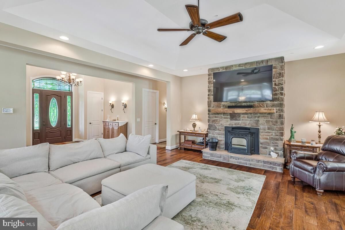 Fireplace, Interior, Living room, Recessed Lighting, Stone Walls, Wood Texture Flooring