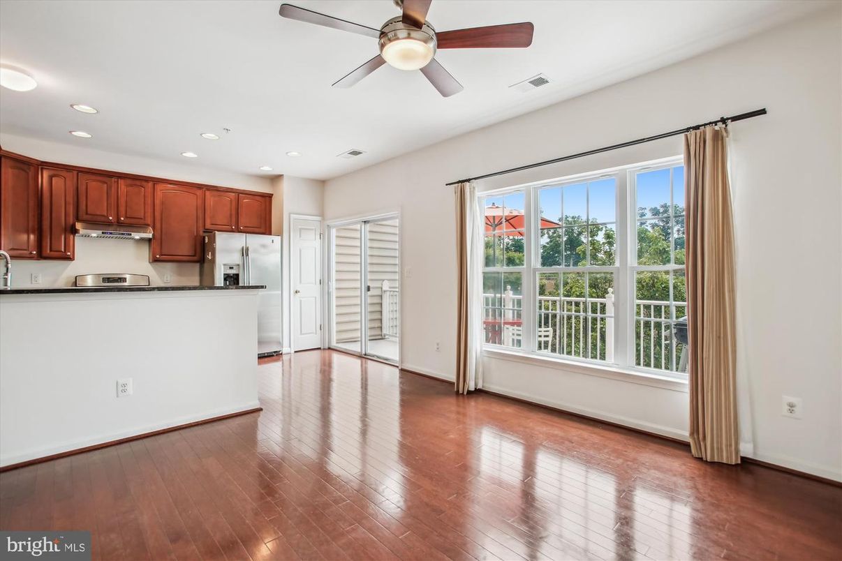 Empty room, Interior, Kitchen, Recessed Lighting, Stainless Steel Appliances, Wood Texture Flooring