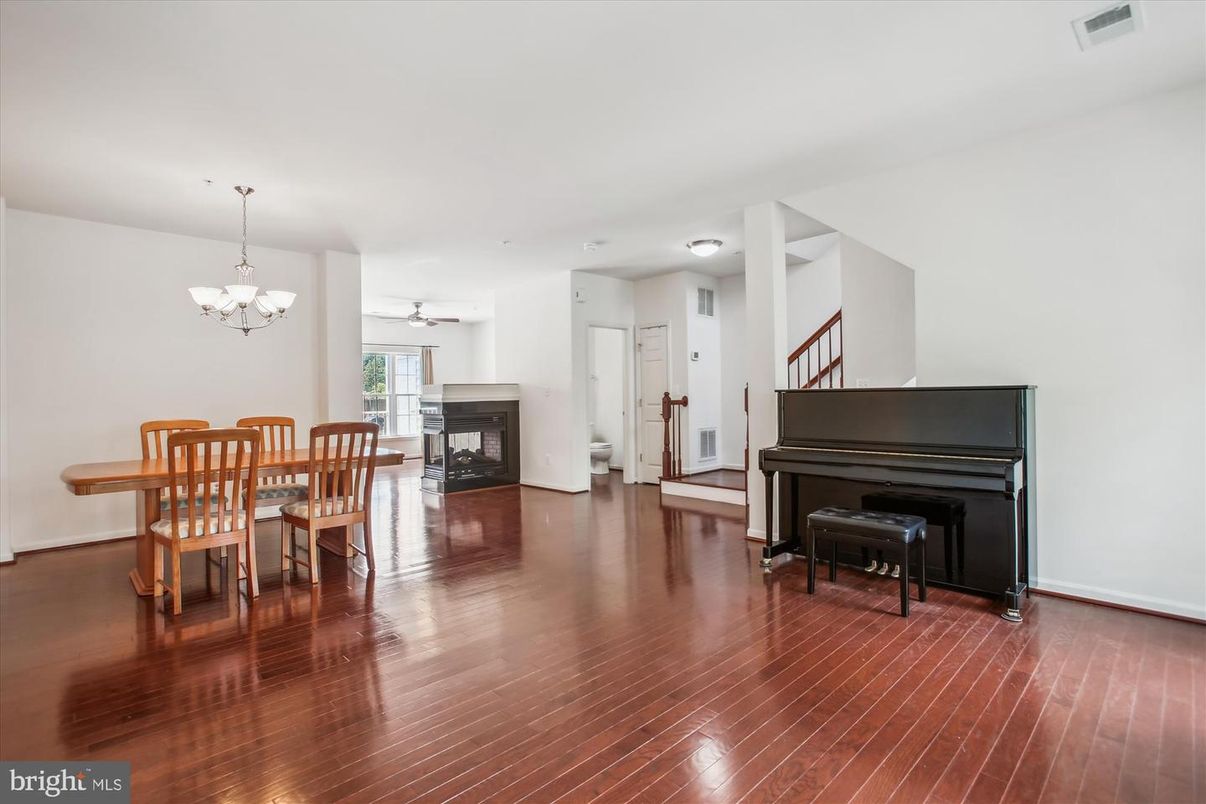 Chandelier, Dining room, Interior, Piano, Wood Texture Flooring