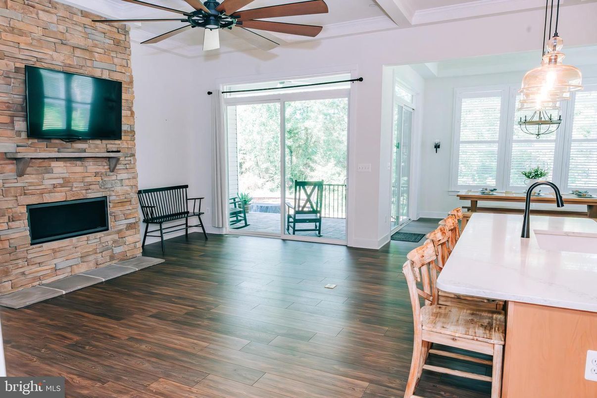 Dining room, Fireplace, Interior, Kitchen, Pendant Lights, Stone Walls, Wood Texture Flooring