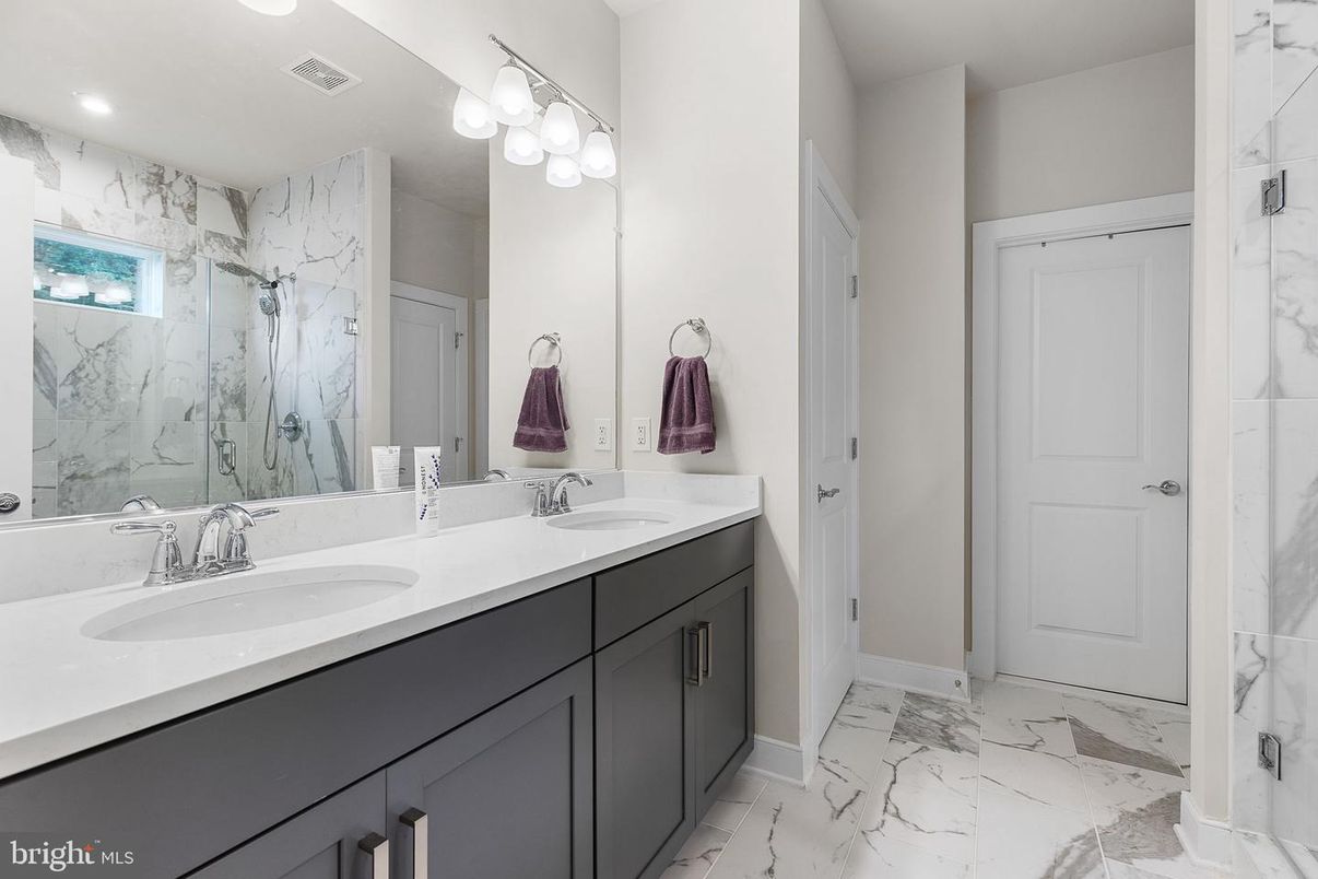 Bathroom, Dual Sink Vanities, Interior, Marble, Marble Walls, Recessed Lighting