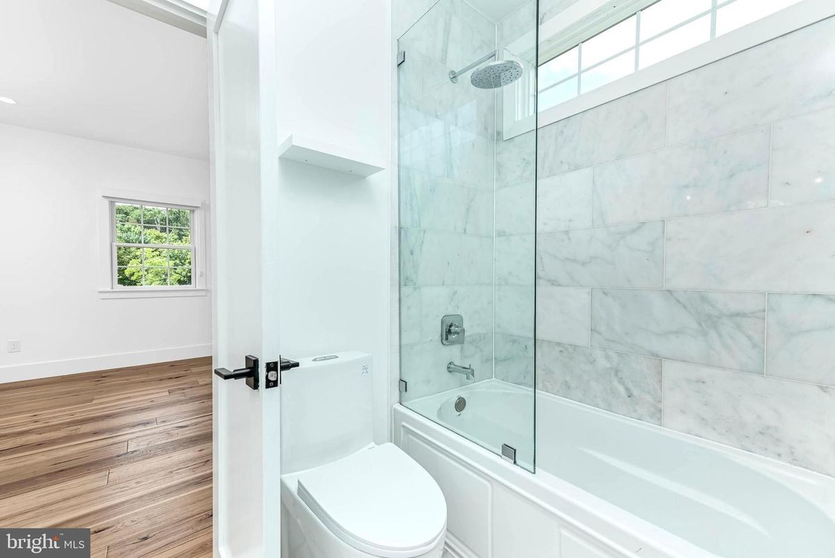 Bathroom, Glass Shower, Interior, Marble Walls, Recessed Lighting, Wood Texture Flooring