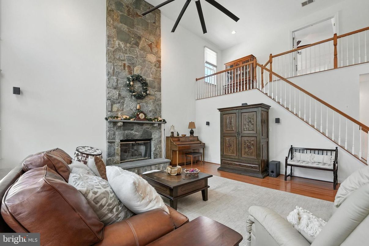 Fireplace, Interior, Living room, Recessed Lighting, Stone Walls, Wood Texture Flooring