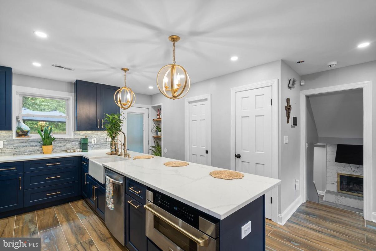 Fireplace, Interior, Kitchen, Pendant Lights, Recessed Lighting, Stainless Steel Appliances, Wood Texture Flooring