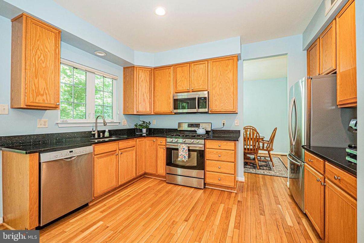 Dining room, Interior, Kitchen, Recessed Lighting, Stainless Steel Appliances, Wood Texture Flooring