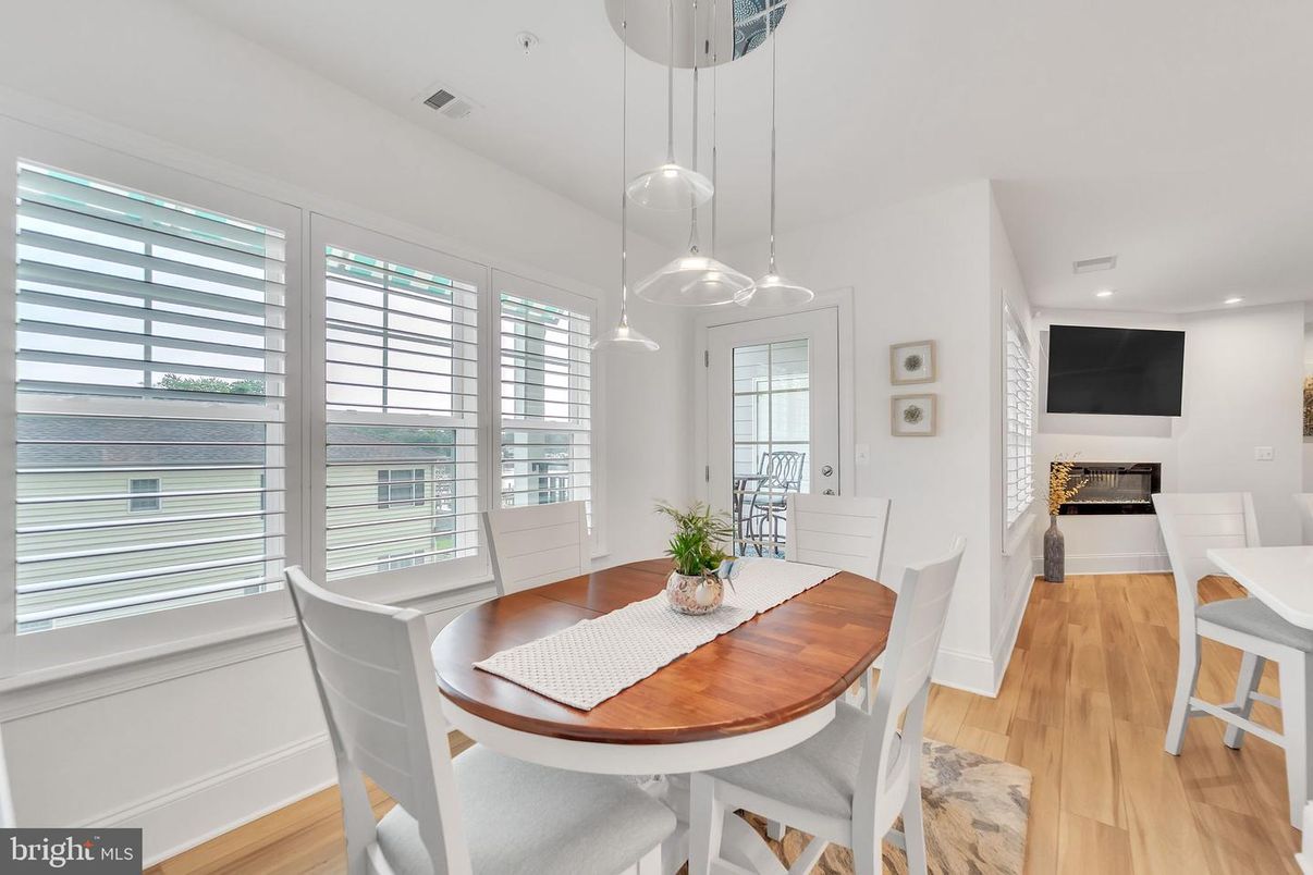 Dining room, Fireplace, Interior, Pendant Lights, Recessed Lighting, Wood Texture Flooring