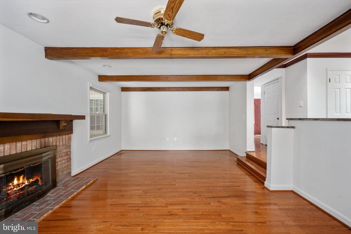 Empty room, Fireplace, Interior, Recessed Lighting, Wooden Beams, Wood Texture Flooring