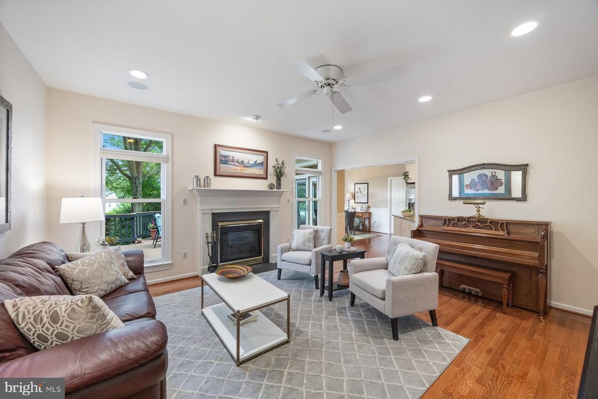 Fireplace, Interior, Living room, Piano, Recessed Lighting, Wood Texture Flooring