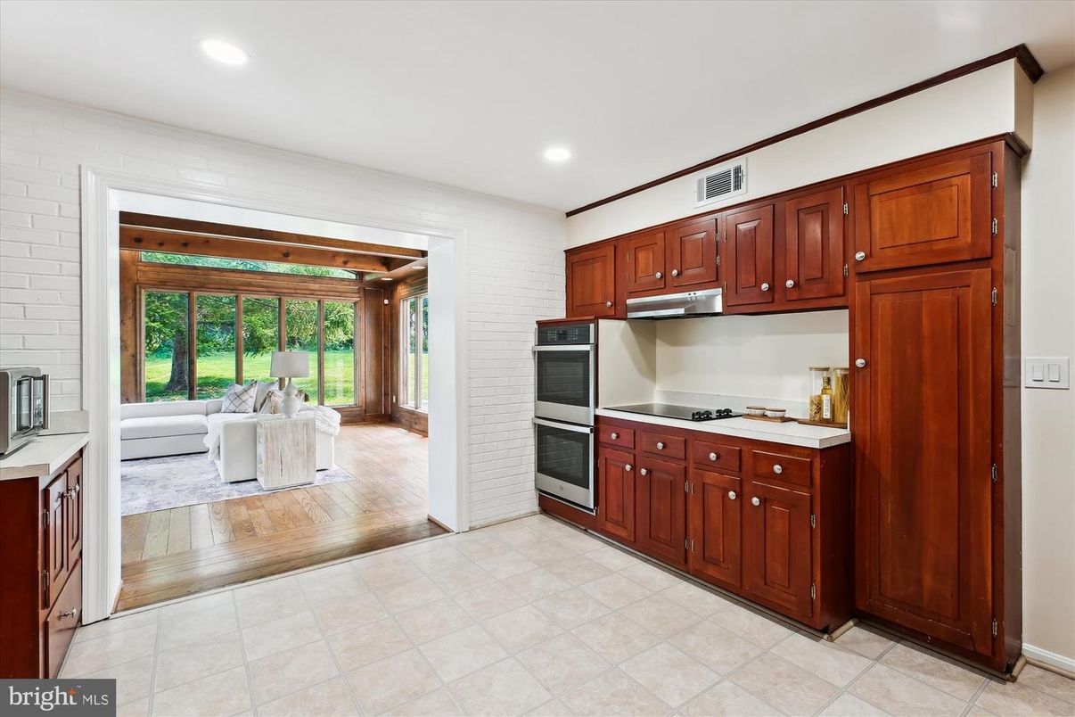 Interior, Kitchen, Living room, Recessed Lighting, Stainless Steel Appliances, Stone Walls, Wood Texture Flooring