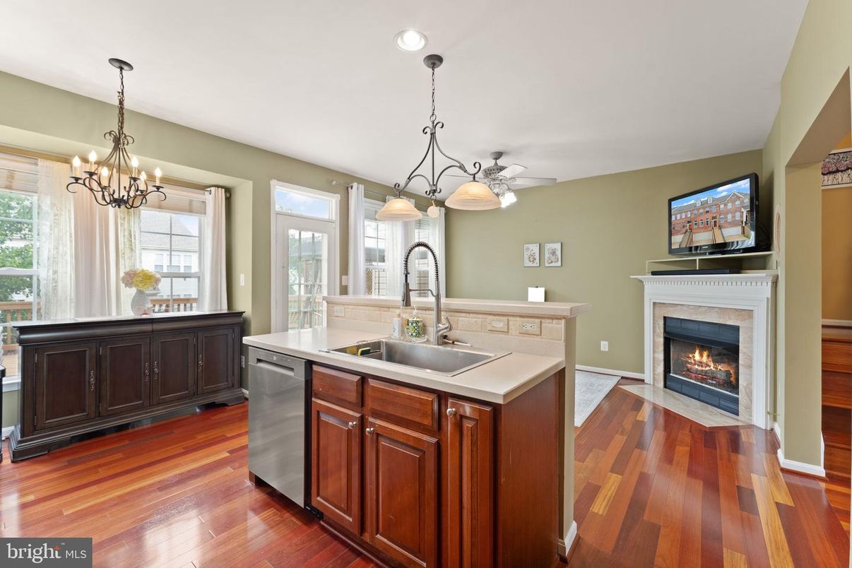 Chandelier, Fireplace, Interior, Kitchen, Pendant Lights, Recessed Lighting, Wood Texture Flooring