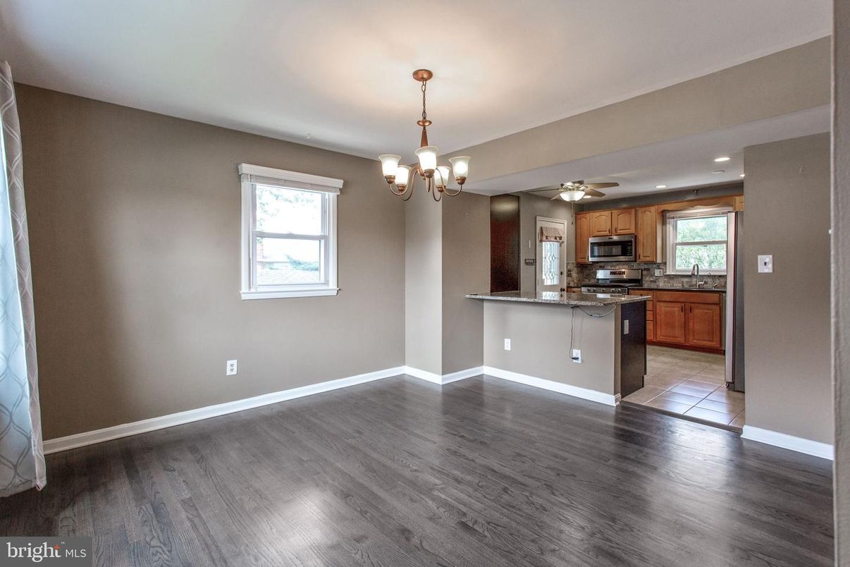 Chandelier, Empty room, Interior, Kitchen, Recessed Lighting, Stainless Steel Appliances, Wood Texture Flooring