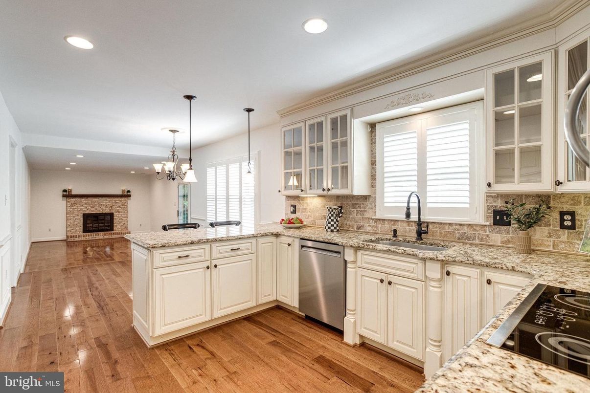 Chandelier, Fireplace, Interior, Kitchen, Pendant Lights, Recessed Lighting, Stone Walls, Wood Texture Flooring