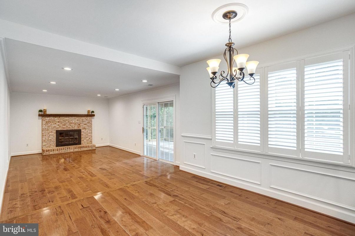 Chandelier, Empty room, Fireplace, Interior, Recessed Lighting, Wood Texture Flooring