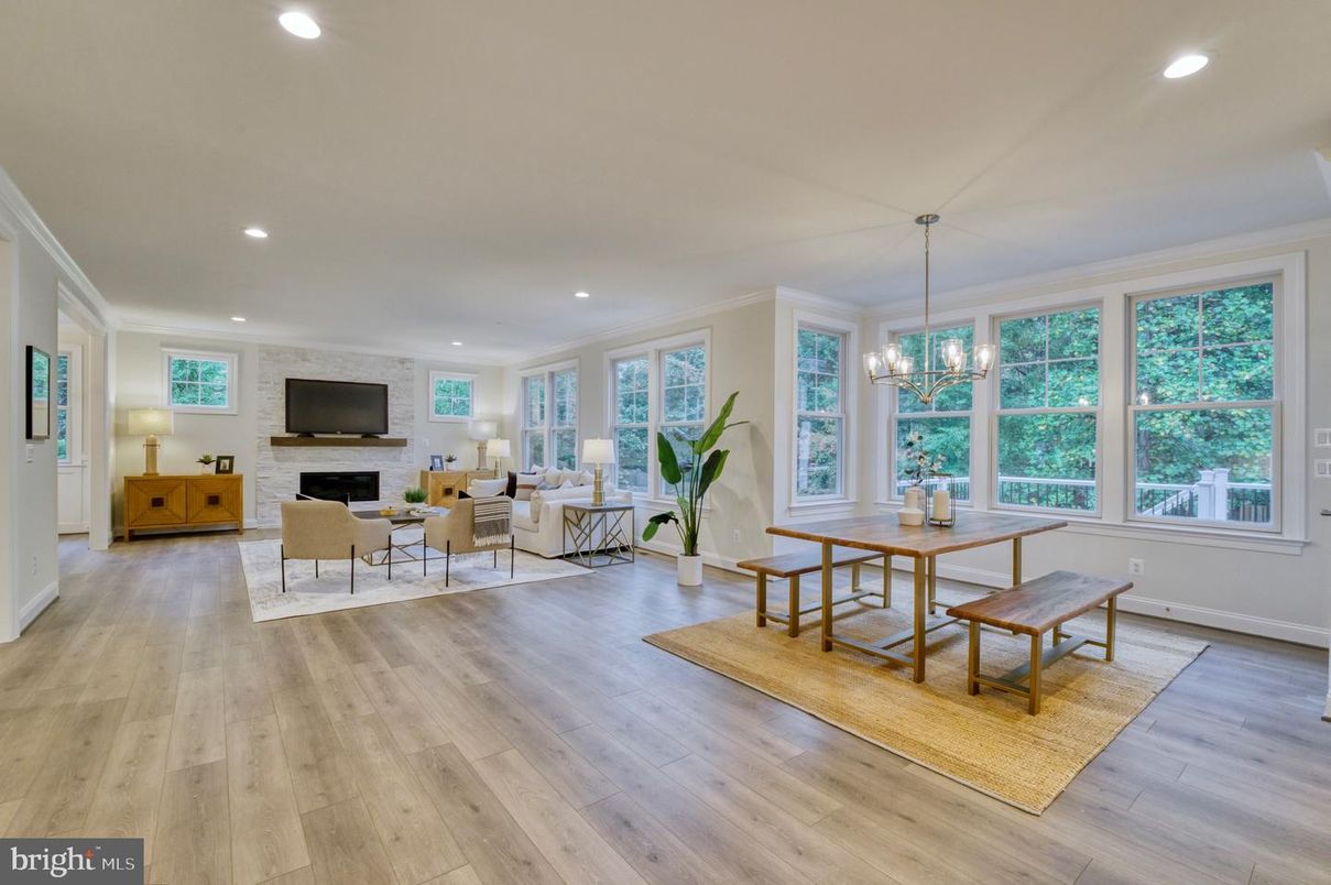 Dining room, Fireplace, Interior, Living room, Recessed Lighting, Stone Walls, Wood Texture Flooring