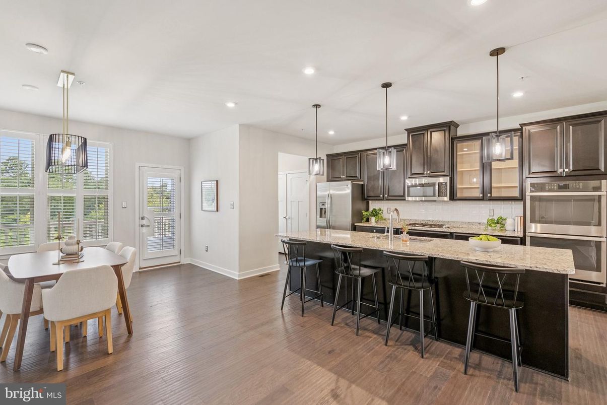 Dining room, Interior, Kitchen, Pendant Lights, Recessed Lighting, Stainless Steel Appliances, Wood Texture Flooring