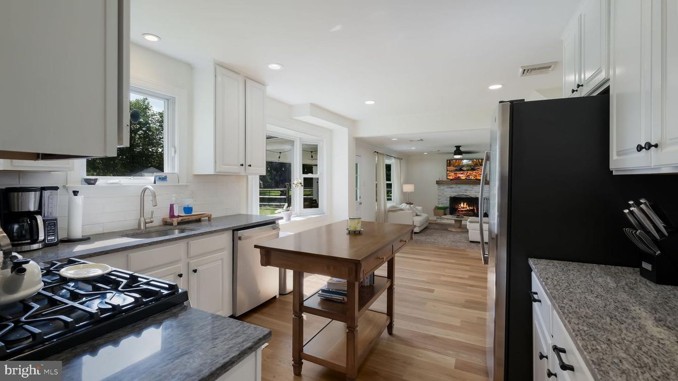 Fireplace, Interior, Kitchen, Living room, Recessed Lighting, Stainless Steel Appliances, Wood Texture Flooring