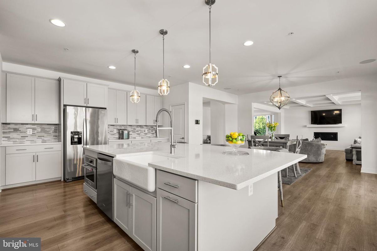 Dining room, Fireplace, Interior, Kitchen, Pendant Lights, Recessed Lighting, Stainless Steel Appliances, Wood Texture Flooring