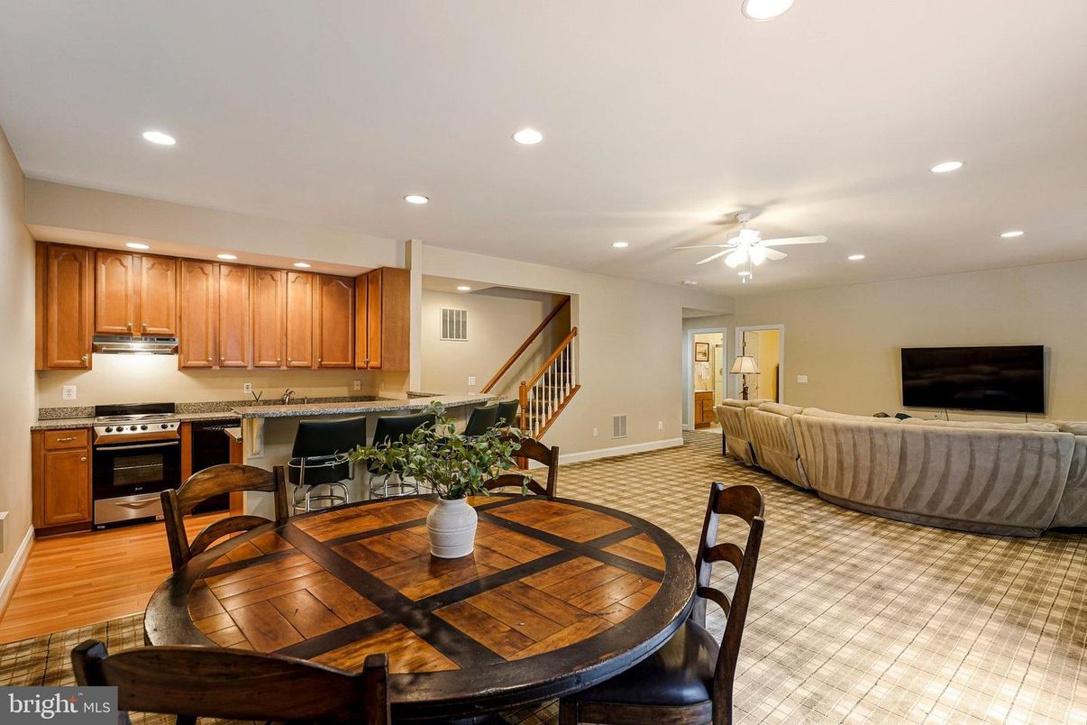 Dining room, Interior, Kitchen, Living room, Recessed Lighting, Stainless Steel Appliances, Wood Texture Flooring