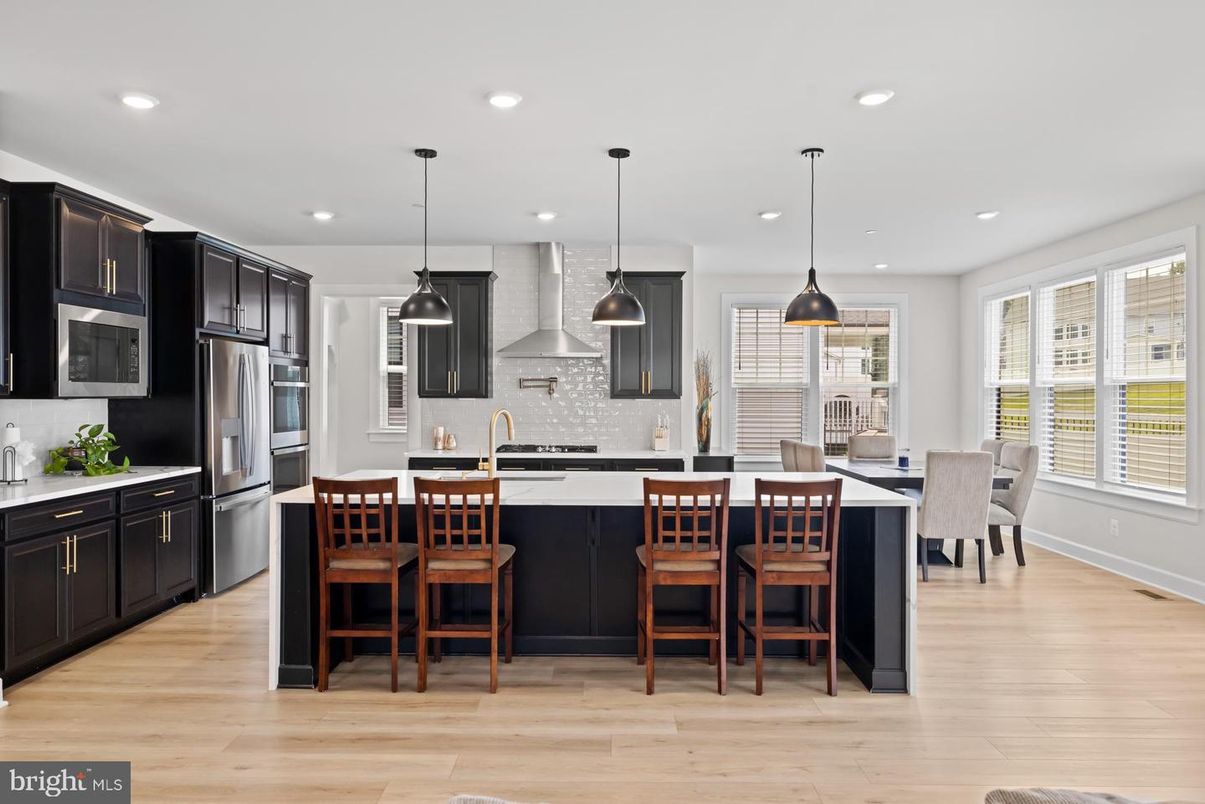 Dining room, Interior, Kitchen, Pendant Lights, Recessed Lighting, Stainless Steel Appliances, Wood Texture Flooring