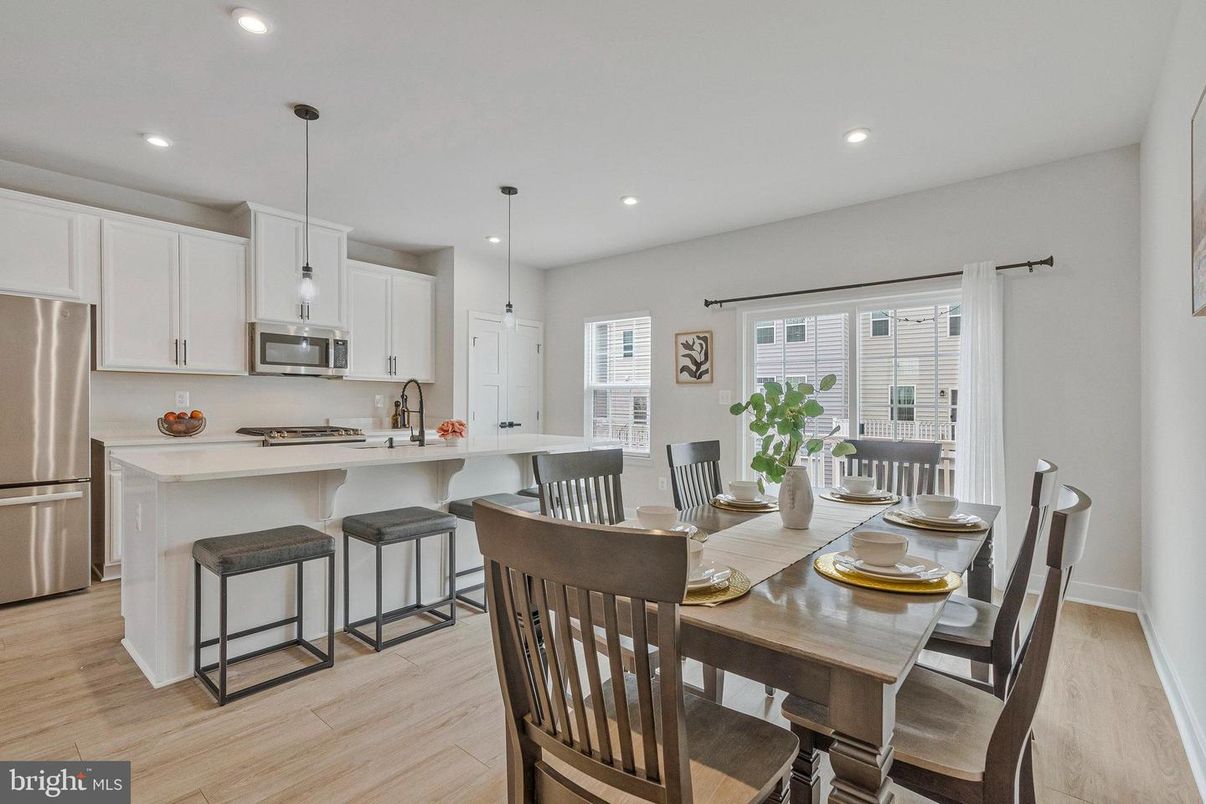 Dining room, Interior, Kitchen, Pendant Lights, Recessed Lighting, Stainless Steel Appliances, Wood Texture Flooring