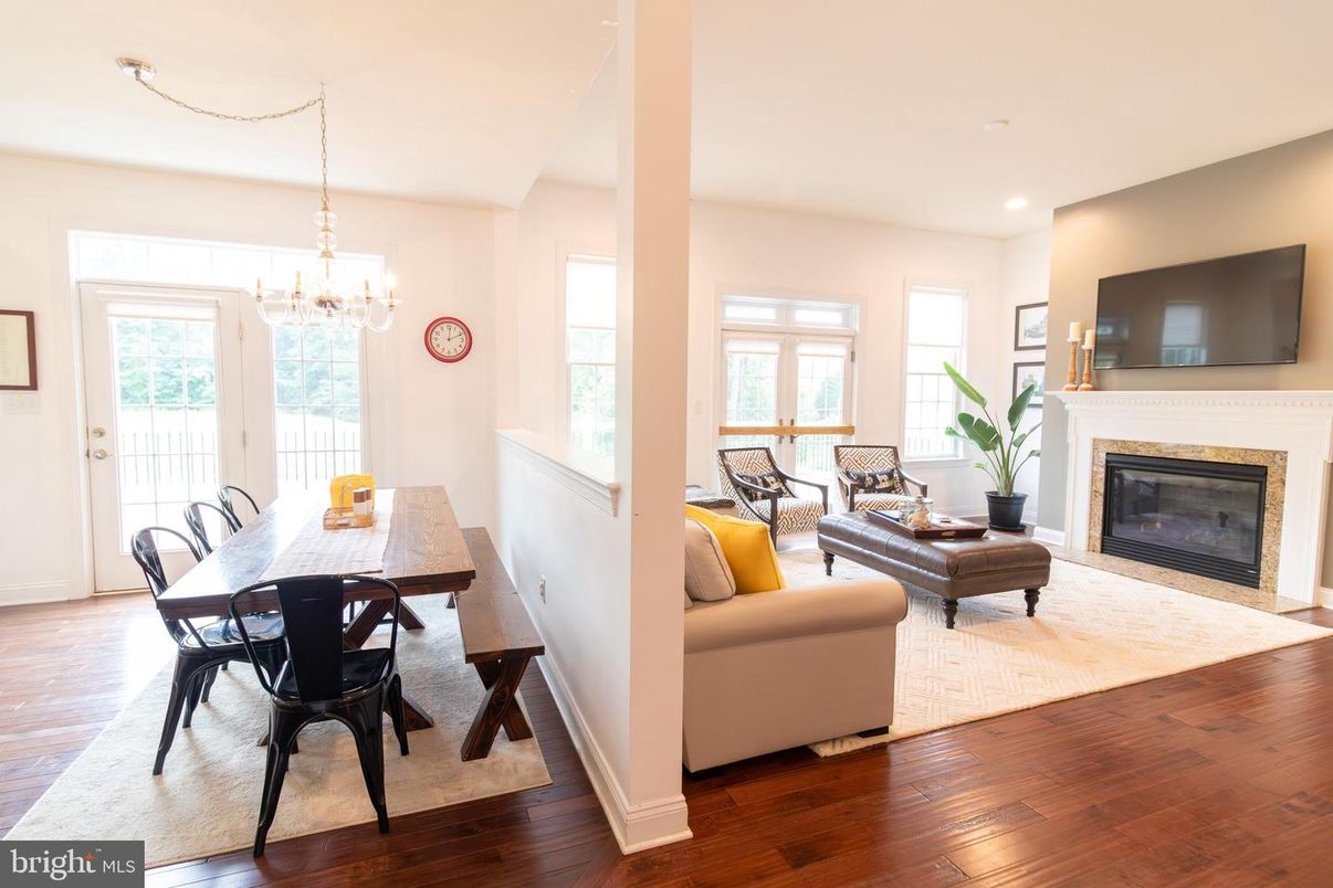 Chandelier, Dining room, Fireplace, Interior, Living room, Recessed Lighting, Wood Texture Flooring