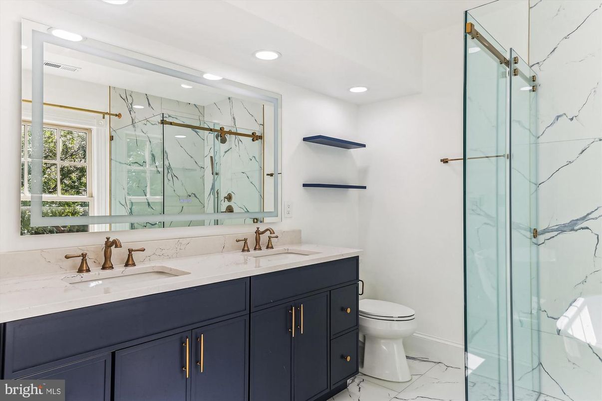 Bathroom, Dual Sink Vanities, Glass Shower, Interior, Marble, Marble Walls, Recessed Lighting