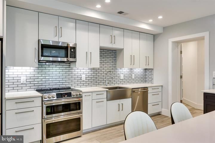 Interior, Kitchen, Recessed Lighting, Stainless Steel Appliances, Wood Texture Flooring