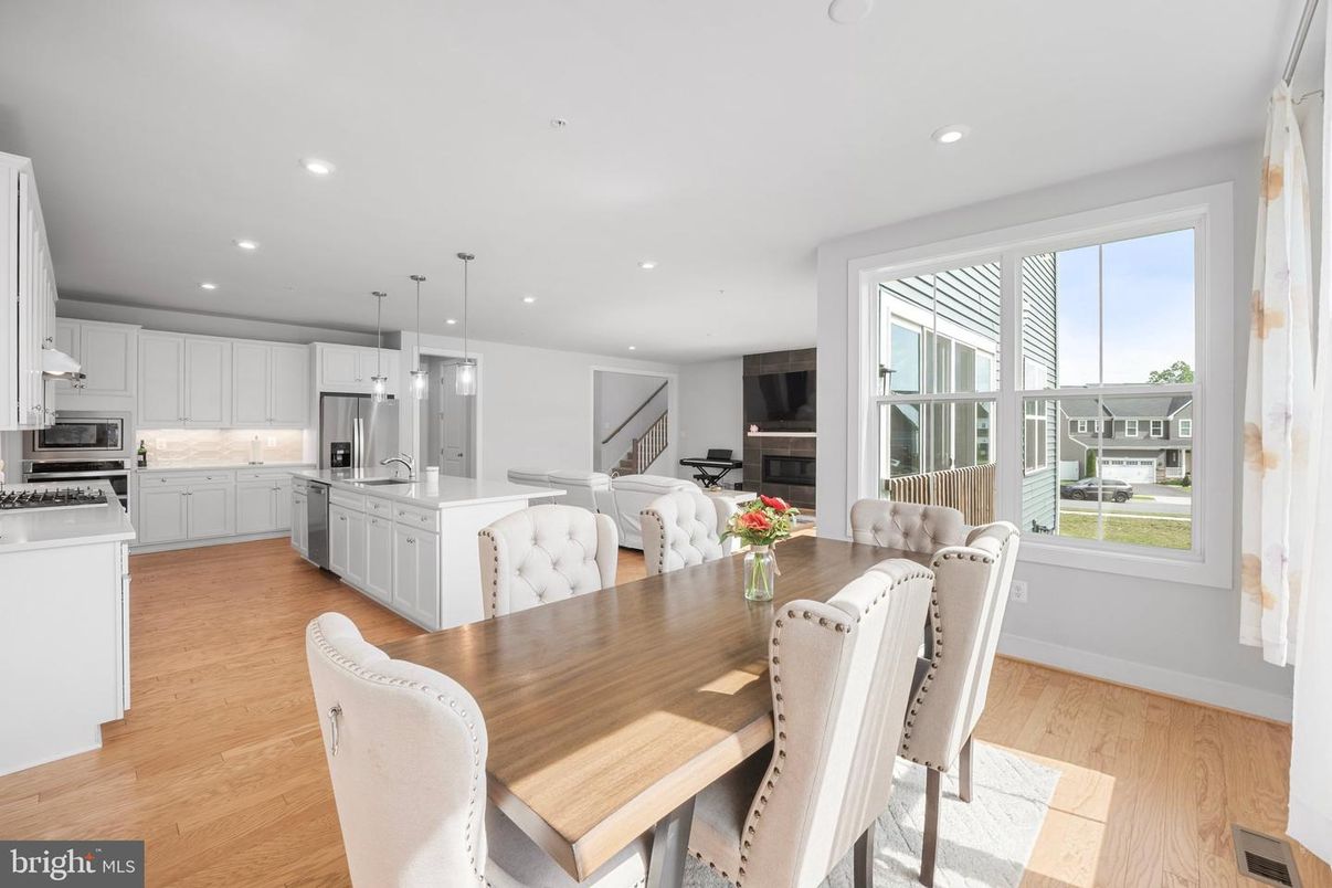 Dining room, Interior, Kitchen, Pendant Lights, Recessed Lighting, Stainless Steel Appliances, Wood Texture Flooring