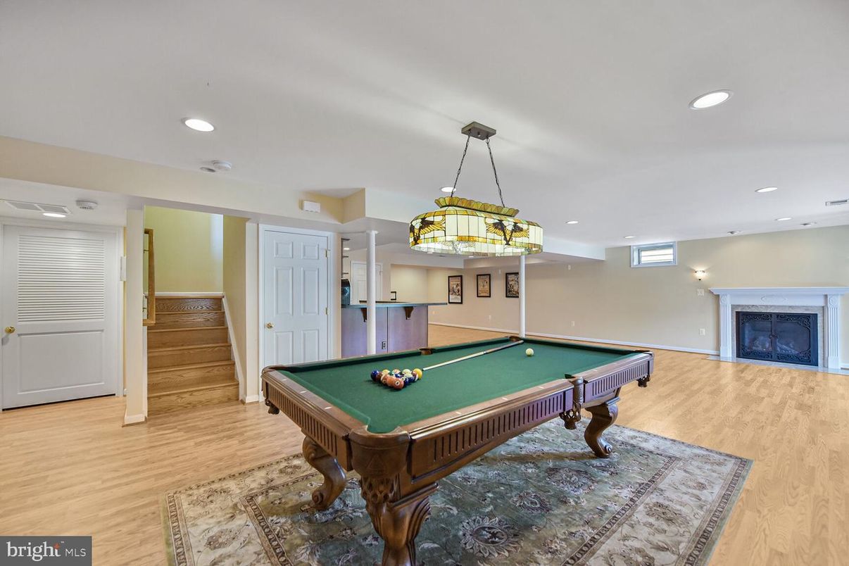 Billiard Table, Fireplace, Game Room, Interior, Pendant Lights, Recessed Lighting, Wood Texture Flooring