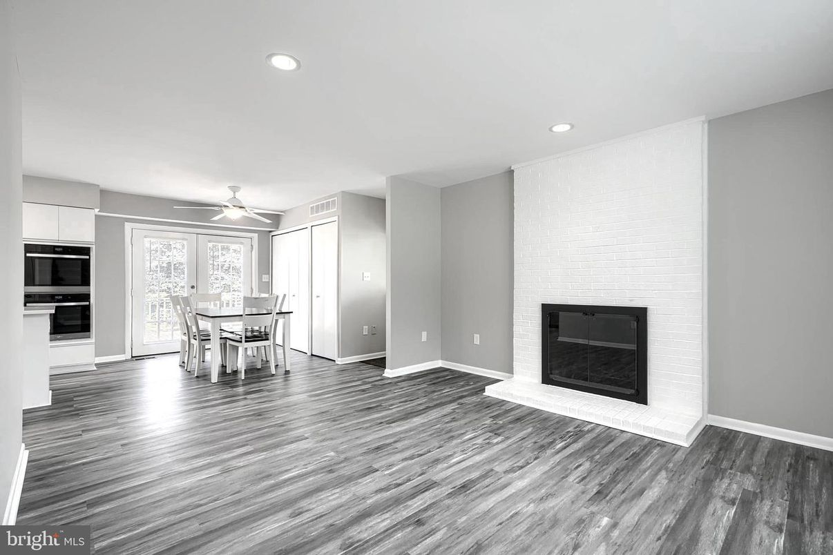Dining room, Fireplace, Interior, Kitchen, Recessed Lighting, Stone Walls, Wood Texture Flooring