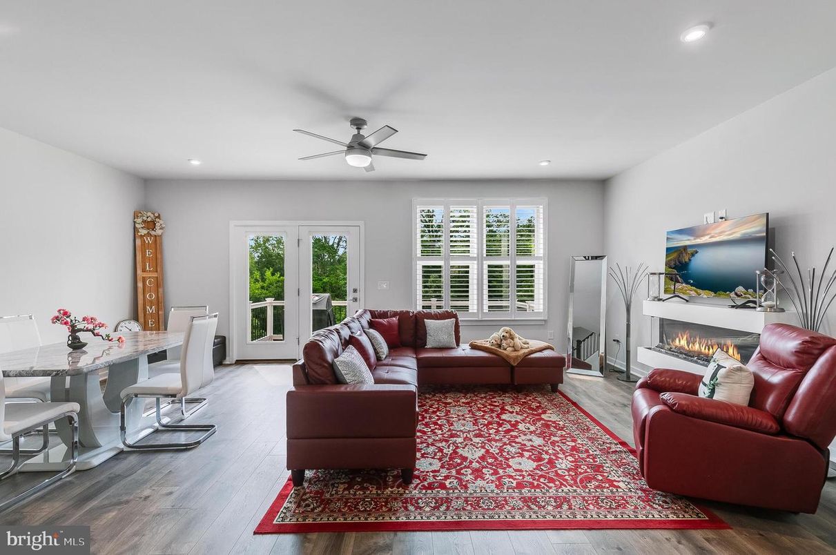 Dining room, Fireplace, Interior, Living room, Recessed Lighting, Wood Texture Flooring