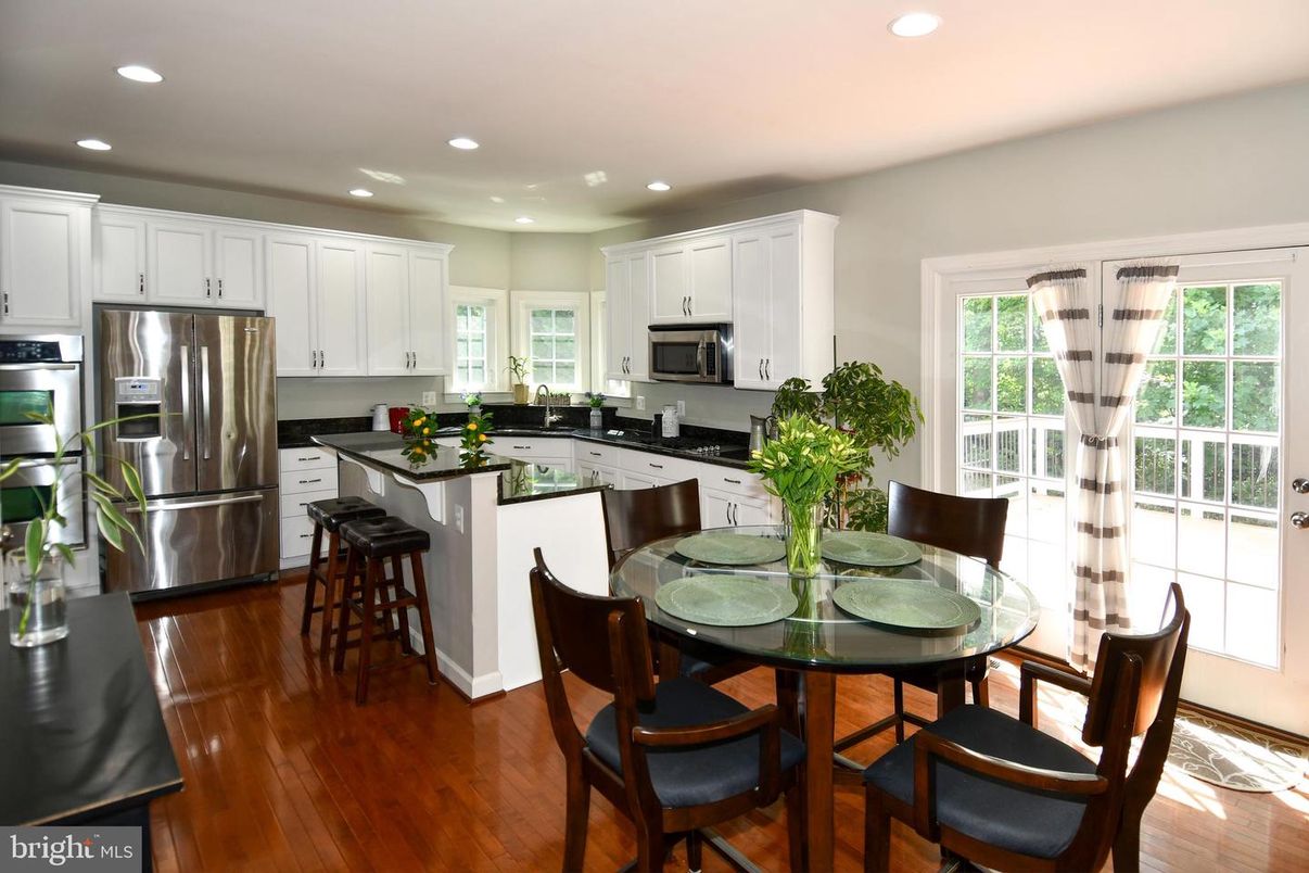 Dining room, Interior, Kitchen, Recessed Lighting, Stainless Steel Appliances, Wood Texture Flooring