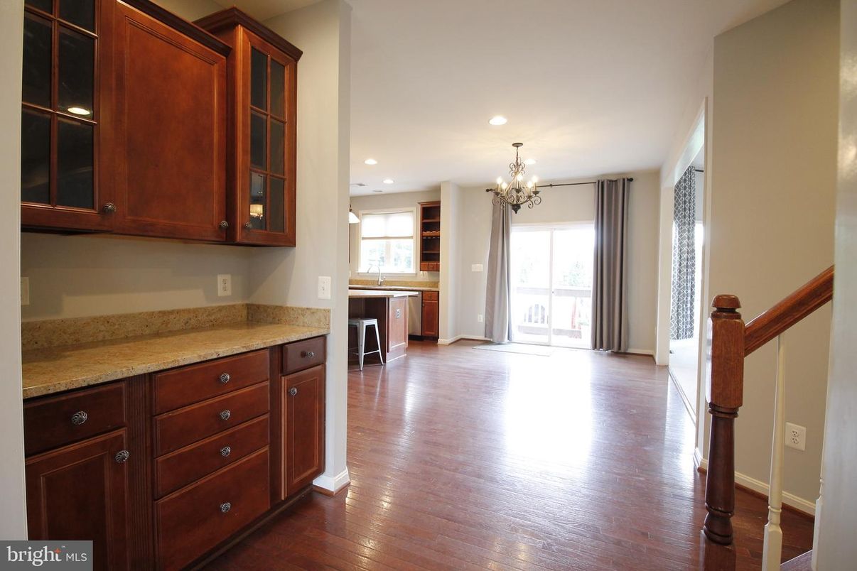 Chandelier, Empty room, Interior, Kitchen, Recessed Lighting, Stainless Steel Appliances, Wood Texture Flooring
